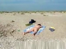 voyeur en la playa