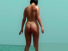 Real playa nudista voyeur coños estiramiento en la arena